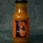 Eckart Mango Sauce No. 4 (250ml), hochwertig präsentiert auf einer Schieferplatte für Gezer Gastro-Kunden.